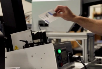 A person working with a Cardserter