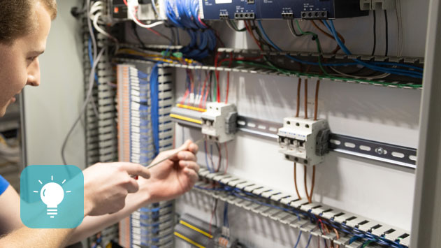 A man fixing warehouse automation systems.