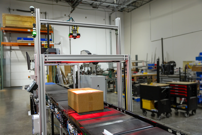 A machine scanning a package for fulfillment accuracy