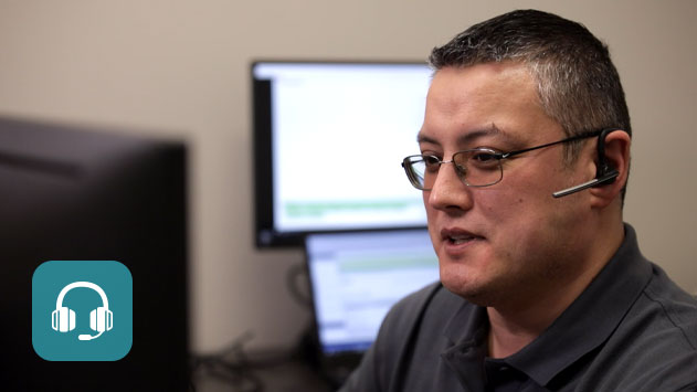 A man helping a StreamTech customer with remote technical support