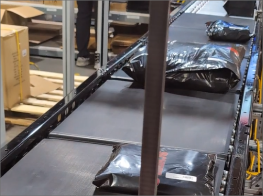 Plastic packages on a conveyor belt